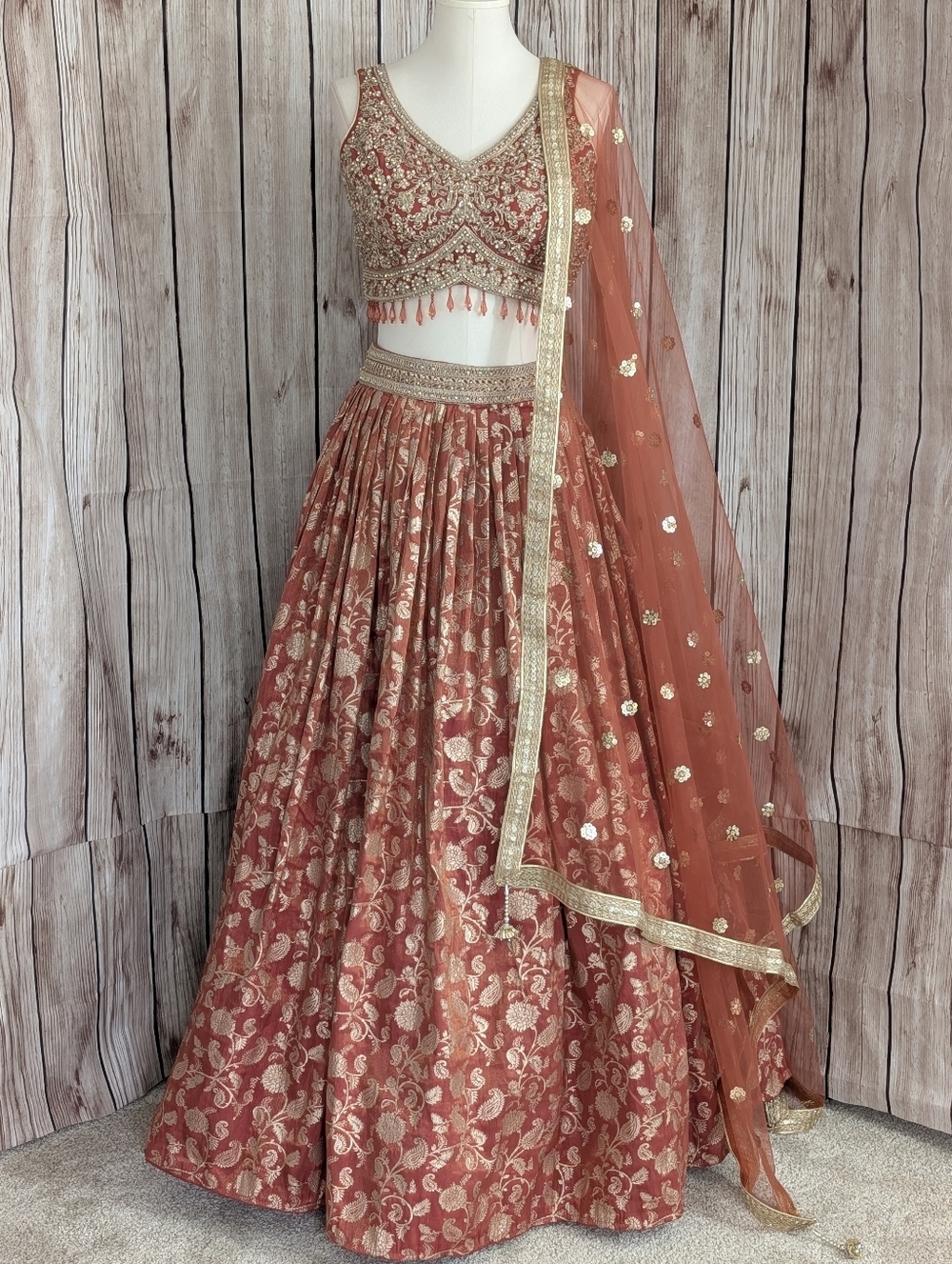 Rust Orange And Gold Embellished Lehenga Choli Set